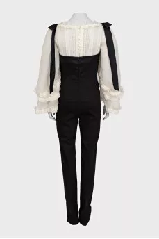 Black jumpsuit with white silk top