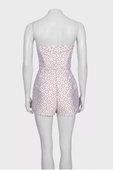 White jumpsuit with printed shorts