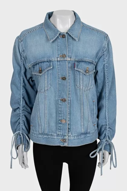 Blue denim jacket with tie sleeves