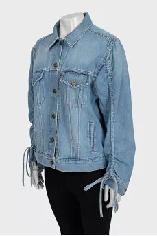 Blue denim jacket with tie sleeves