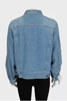Blue denim jacket with tie sleeves