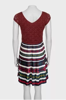 Fitted dress with a pleated skirt