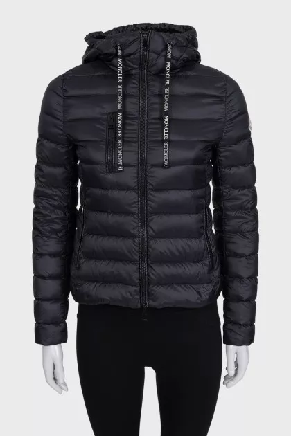 Black zip-up jacket with a hood