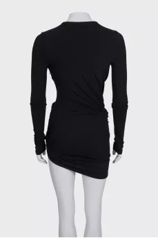 A fitted dress with sleeves decorated with draping