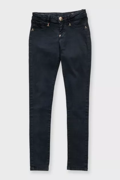 Black skinny jeans with signature gold trim