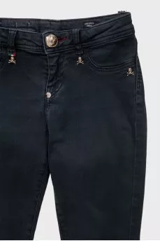 Black skinny jeans with signature gold trim