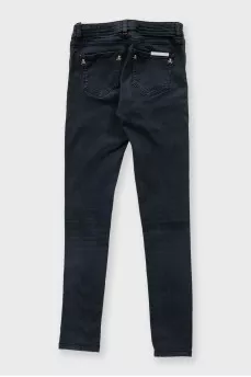 Black skinny jeans with signature gold trim