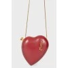 A handbag in the form of a red heart