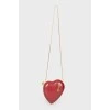 A handbag in the form of a red heart