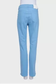High-waisted blue jeans with a gold button
