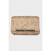Golden patterned clutch bag