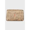 Golden patterned clutch bag