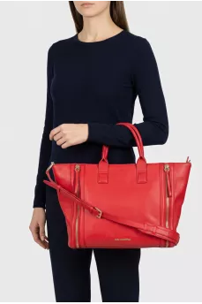 Red leather bag with decorative zippers