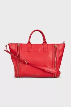 Red leather bag with decorative zippers