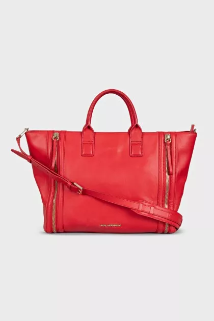 Red leather bag with decorative zippers