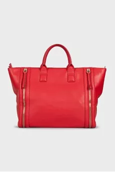 Red leather bag with decorative zippers