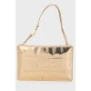 Golden clutch from a brand's logo