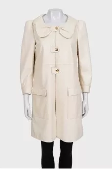 Beige leather coat with accent shoulders
