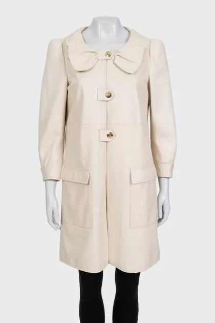 Beige leather coat with accent shoulders