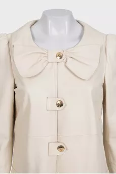 Beige leather coat with accent shoulders