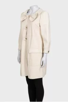 Beige leather coat with accent shoulders