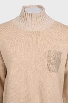 Beige straight-cut suit consisting of a sweater and trousers