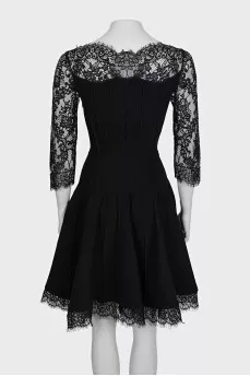 Black fitted dress decorated with lace