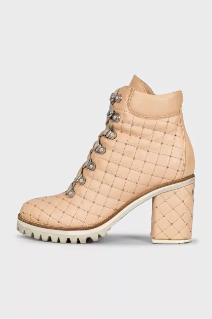 Beige quilted ankle boots with heels
