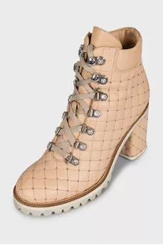 Beige quilted ankle boots with heels