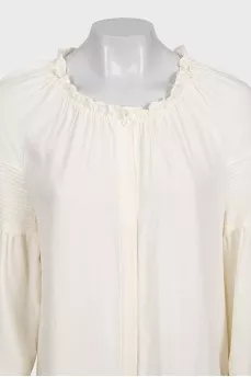 Loose-fitting dress with buttons and long sleeves