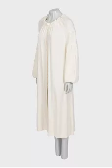 Loose-fitting dress with buttons and long sleeves