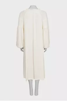 Loose-fitting dress with buttons and long sleeves