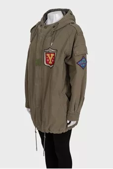 Green parka with a patch