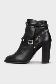Leather ankle boots with heels decorated with studs
