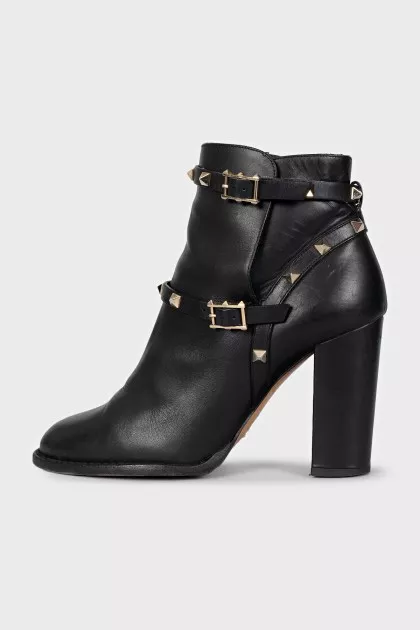 Leather ankle boots with heels decorated with studs
