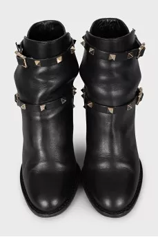 Leather ankle boots with heels decorated with studs