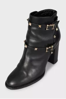Leather ankle boots with heels decorated with studs