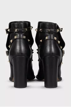 Leather ankle boots with heels decorated with studs