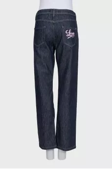 Dark blue jeans with embroidery on the pocket