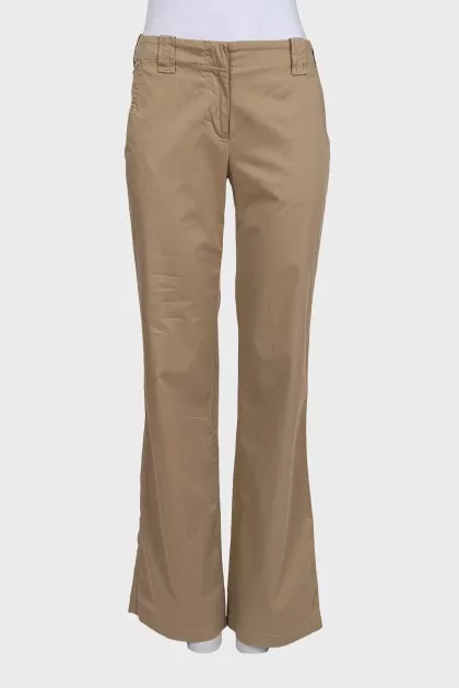 Beige mid-rise trousers with pockets