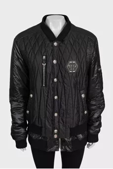 Black quilted bomber jacket with signature logo on the back