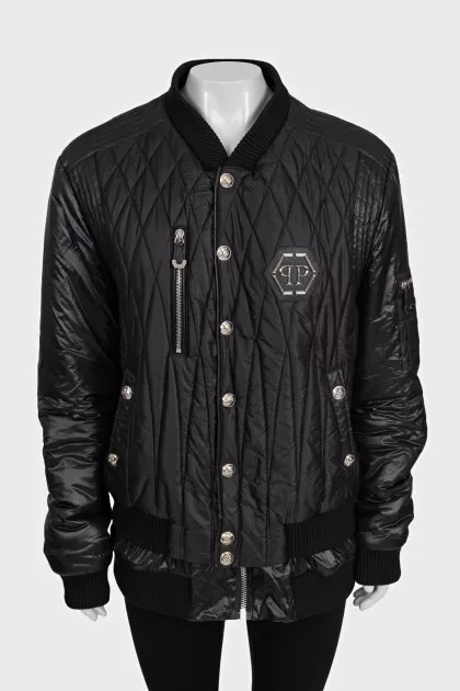Black quilted bomber jacket with signature logo on the back