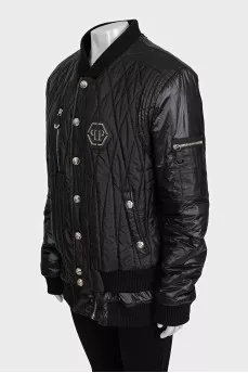 Black quilted bomber jacket with signature logo on the back