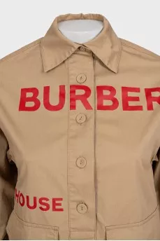 Beige shirt with a contrasting logo