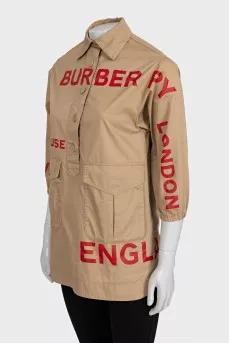 Beige shirt with a contrasting logo