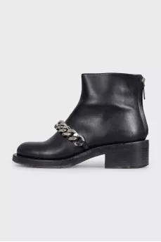 Black leather boots with a silver chain