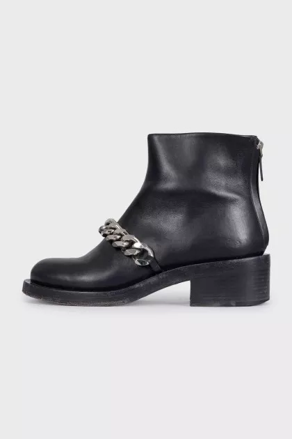Black leather boots with a silver chain