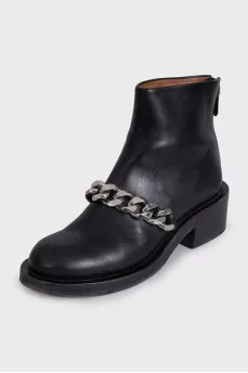 Black leather boots with a silver chain