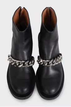 Black leather boots with a silver chain