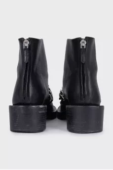 Black leather boots with a silver chain